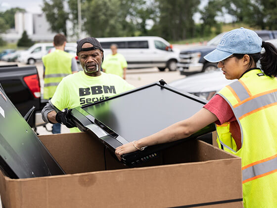 Employees from Big Boys Moving helping with our annual Recycle Day
