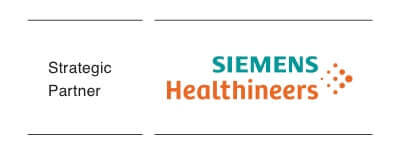 An MRI suite. A doctor stands beside an MRI machine, reviewing the information on suspended monitors. Behind him are additional medical monitoring devices.